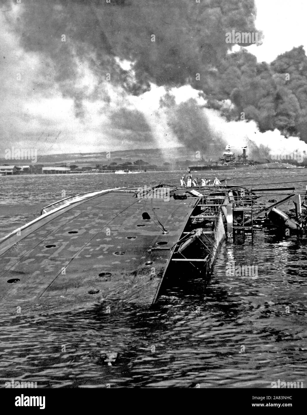 Photograph of the USS Oglala Capsized and Sinking after the Japanese Attack on Pearl Harbor Stock Photo