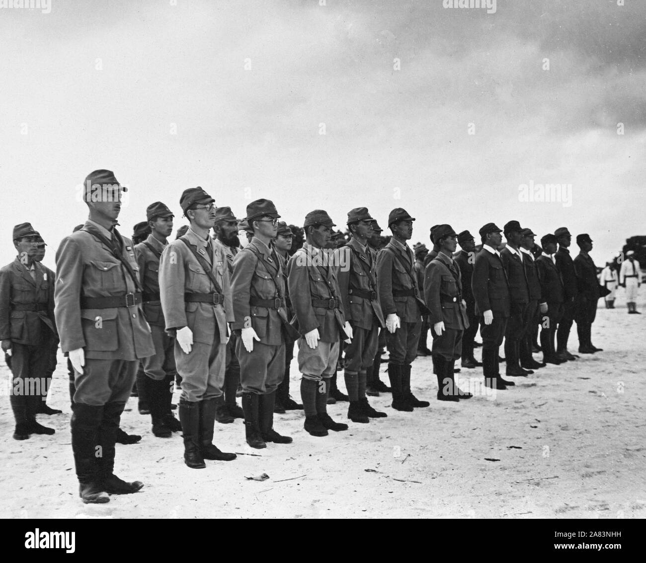 Japanese navy and army soldiers during reading of proclamation making Wake Island ours during WW II Stock Photo