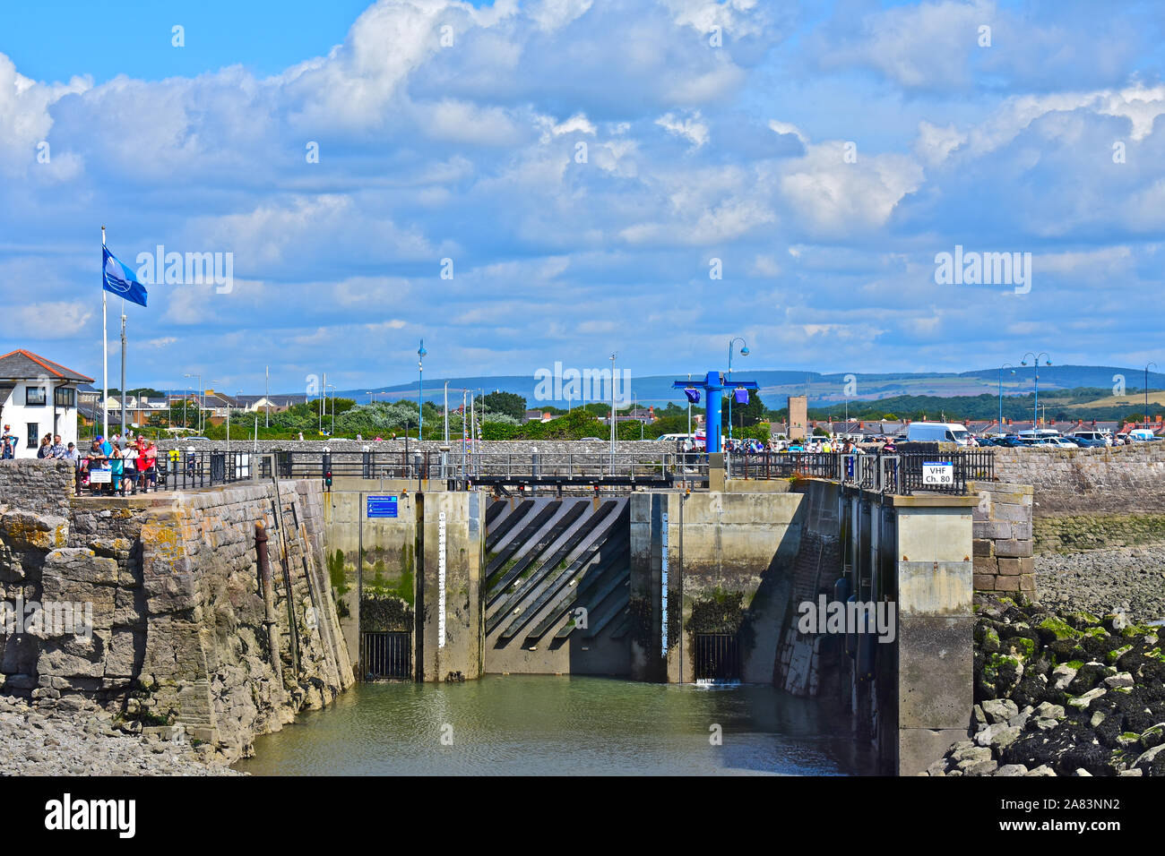 View of entrance to Porthcawl Marina. Lock gates closed at low tide from seaward side. Stock Photo