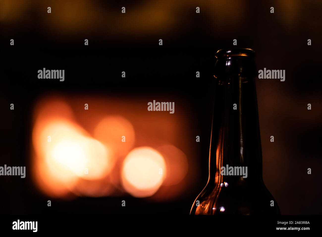 Beer Bottle Transparent Glass Dark Silhouette On A Fire Pit Blurry