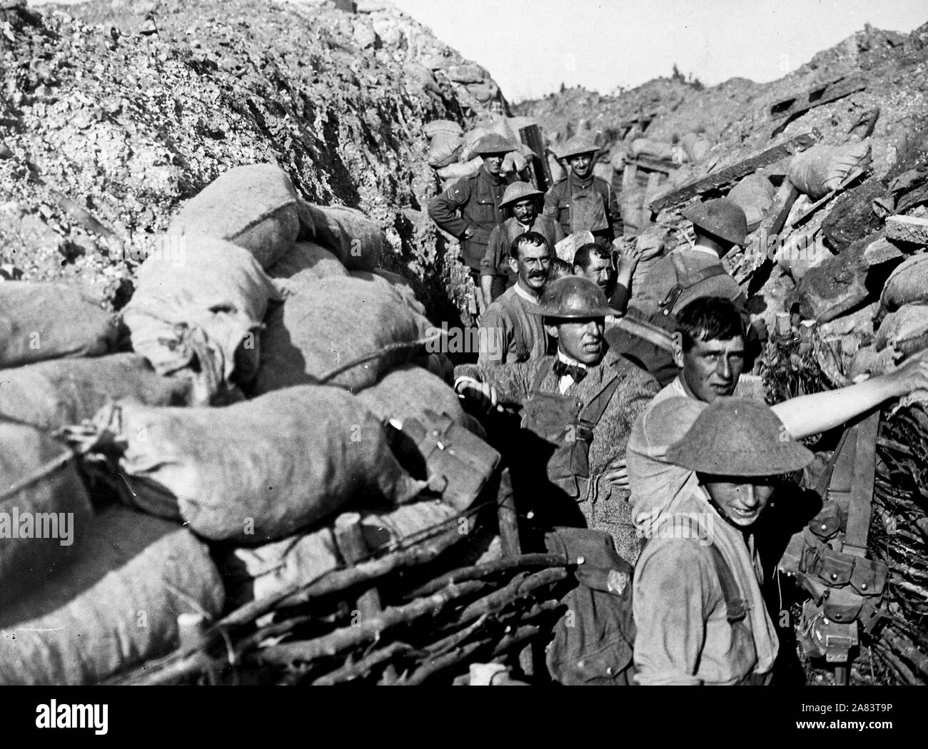Repairing front line trench after bomb explosion fifty yards from enemy trenches. D. W. Griffith in civilian clothing. During filming of the motion picture, the World War I film,  'Hearts of the World' in France, 1917. Stock Photo