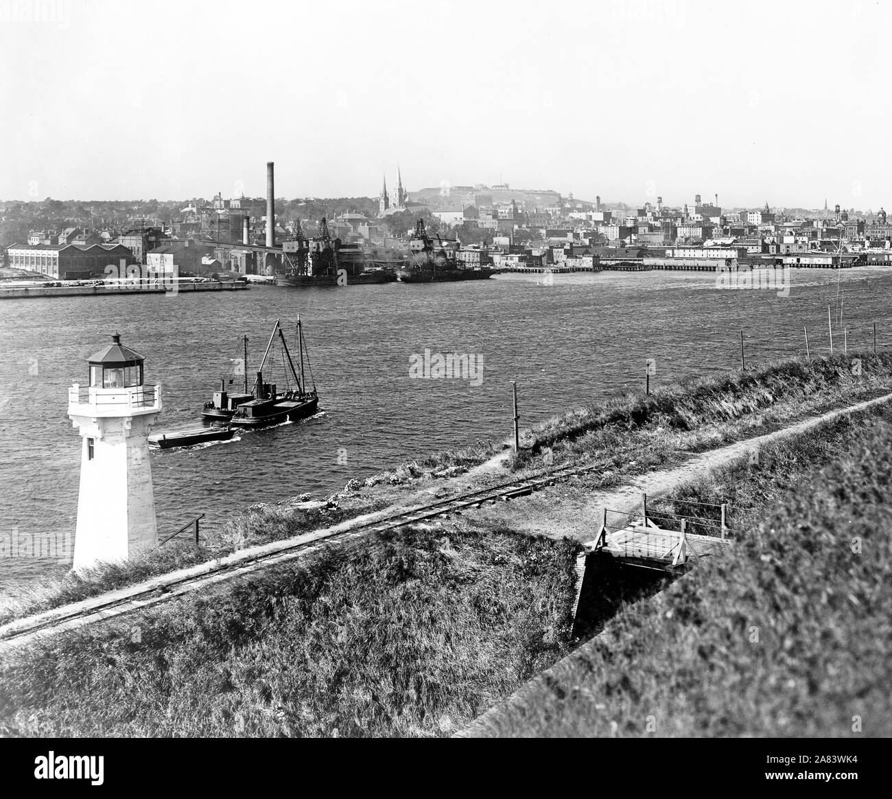 Lighthouse and boat on water, Halifax, Nova Scotia. 1917 Stock Photo