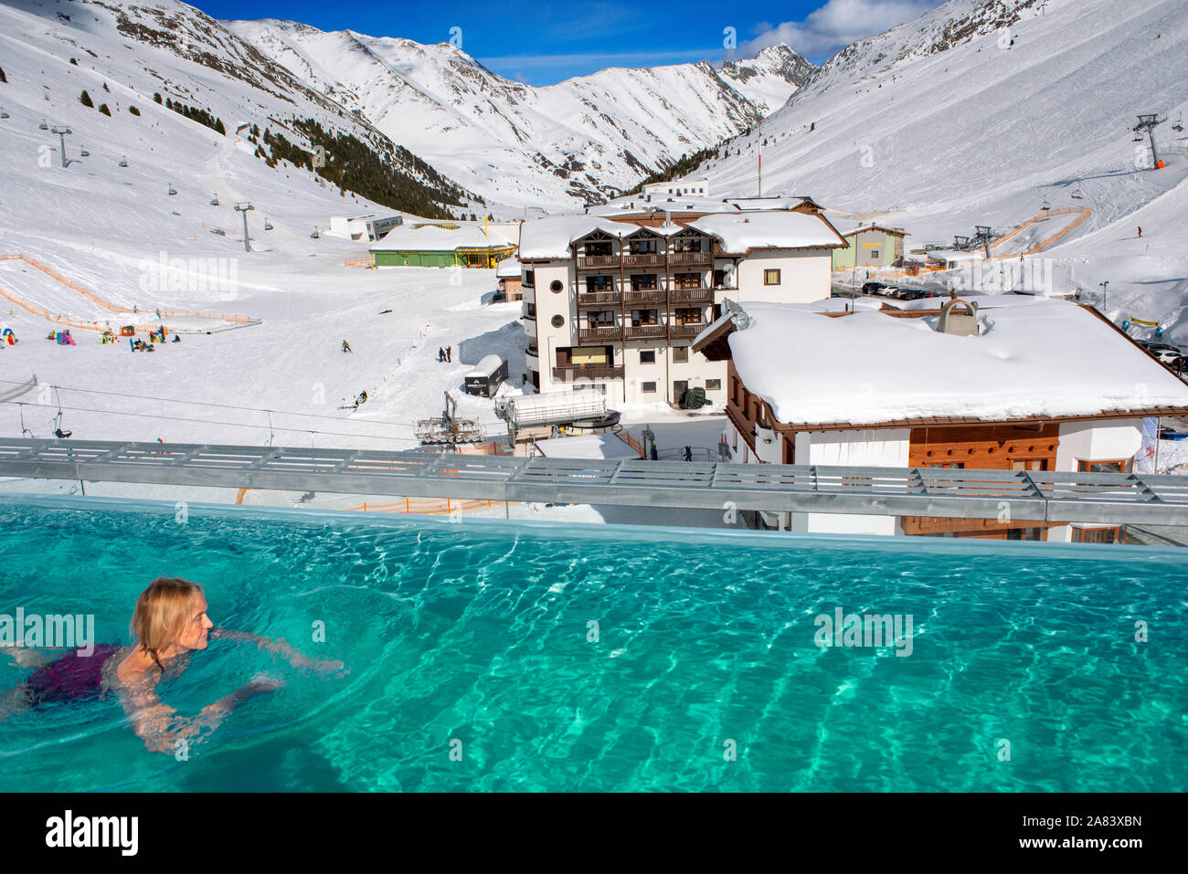 Kuhtai sky resort village and ski slopes near Innsbruck Tyrol Austria. Swimming pool of the Mooshaus Hotel. Stock Photo
