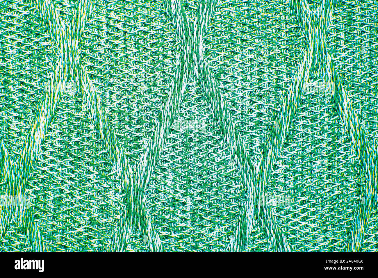 Knit texture of mint wool knitted fabric with cable pattern as background. Stock Photo