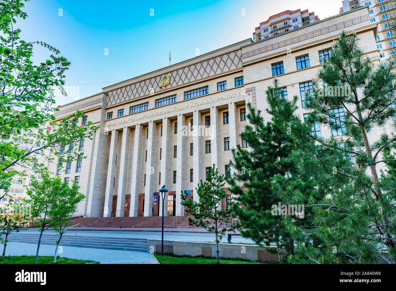 Nur-Sultan Astana Akimat of Saryarka Rayon Government Building Side View on a Sunny Blue Sky Day Stock Photo
