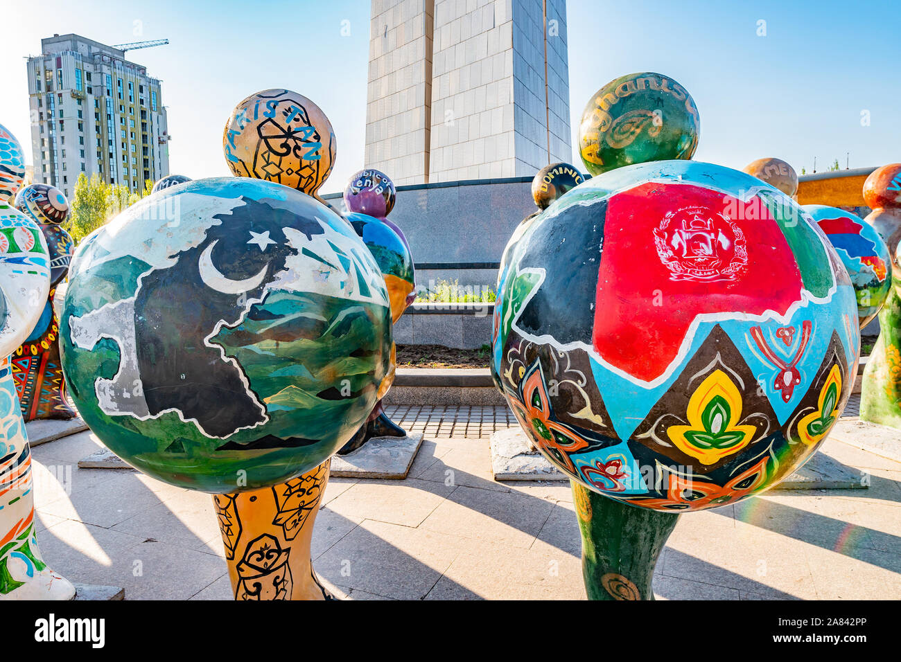 Nur-Sultan Astana Central City Tsentralnyy Gorodskoy Park View of Sculpture Holding Pakistan and Afghanistan Balls on a Sunny Blue Sky Day Stock Photo