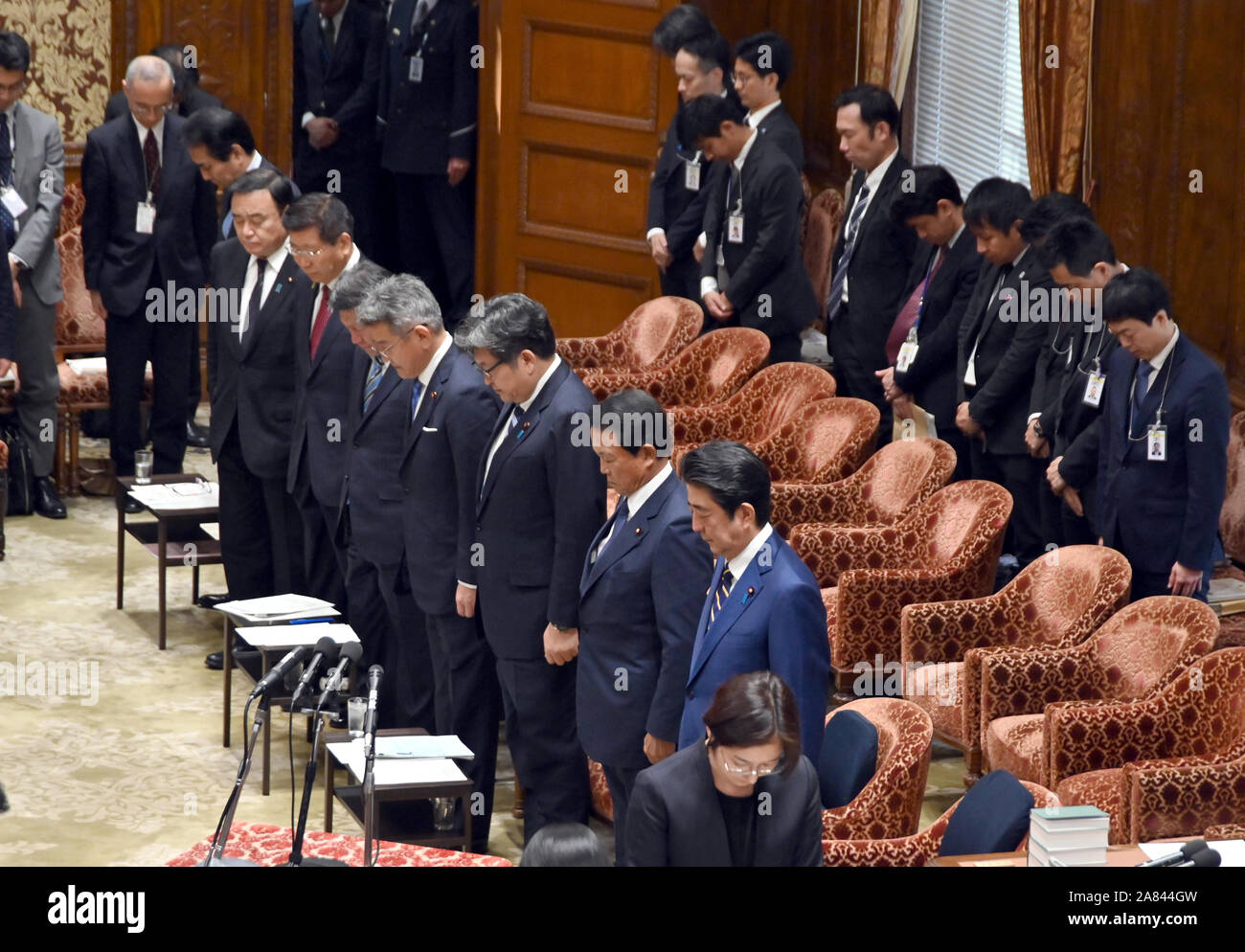 Tokyo, Japan. 6th Nov, 2019. Japans Prime Minister Shinzo Abe, second from right, and his Cabinet ministers offer a one-minute silent prayer to those perished in the recent typhoon that has wreaked havoc over wide swaths of Japans northeastern regions prior to Wednesdays meeting of the Diet lower house budget committee in Tokyo on November 6, 2019. Credit: Natsuki Sakai/AFLO/Alamy Live News Stock Photo