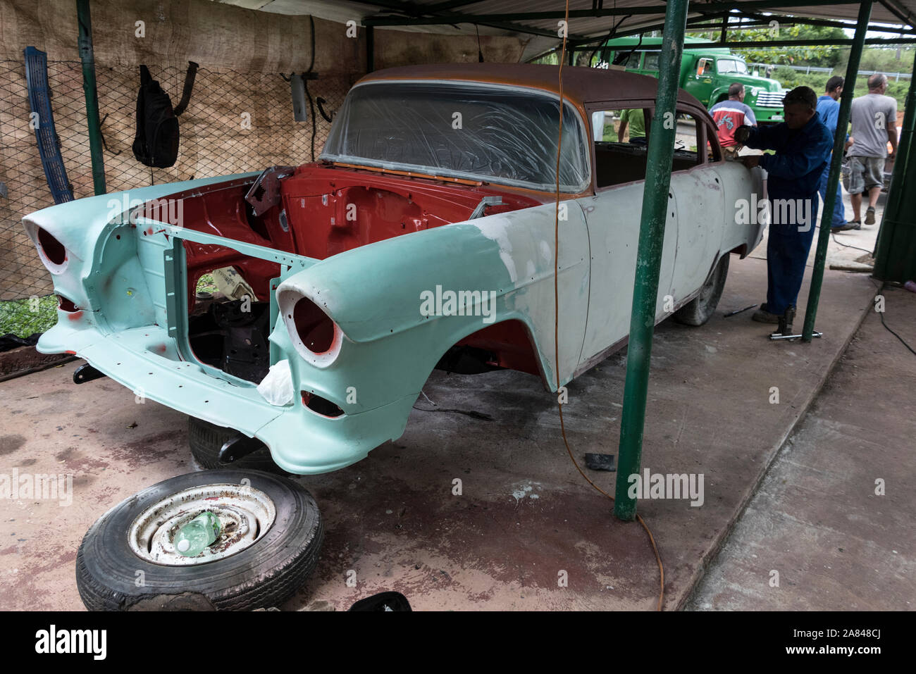 A n American classic car being prepared for a respray at  a small village garage in the Valle de Vinales, Pinar del R’o Province, west Cuba, Cuba Stock Photo