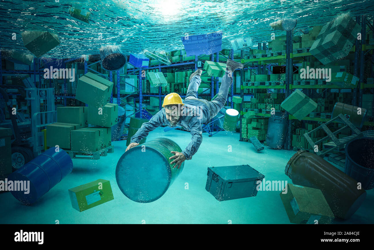Worker clings to a bin in a totally flooded warehouse. Abstract underwater image, concept of problems at work. Stock Photo