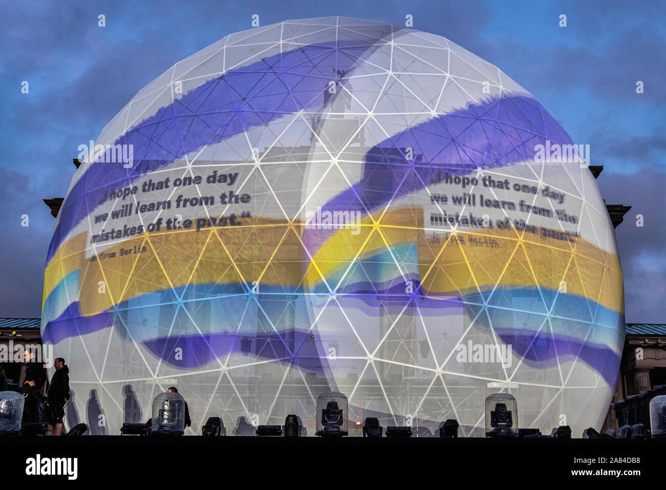 Celebrating 30th Anniversary of the Fall of the Berlin Wall. Concert stage and Huge white globe that is illuminated with messages of peace after dark at the Brandenburg gate, Straße des 17. Juni, Berlin Stock Photo