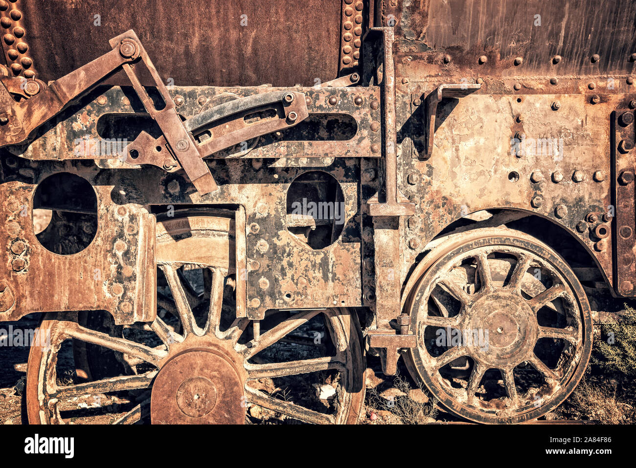 Wheel of an old rusty wagon abandoned in the train cemetery of Uyuni, Bolivia Stock Photo