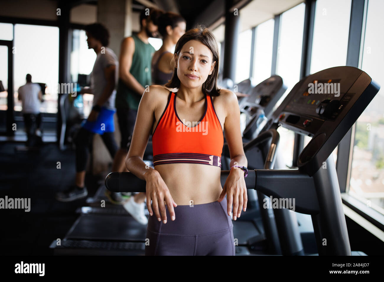 Disappointed tired woman trying to reach fitness goals by endurance and stamina training Stock Photo