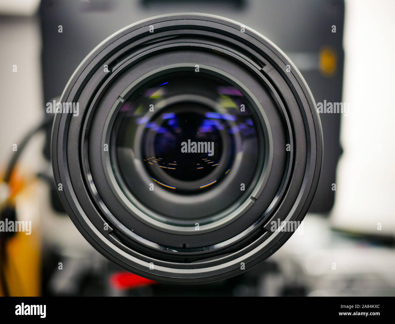Close up shot of camera lens set up filming in the studio. Reflection