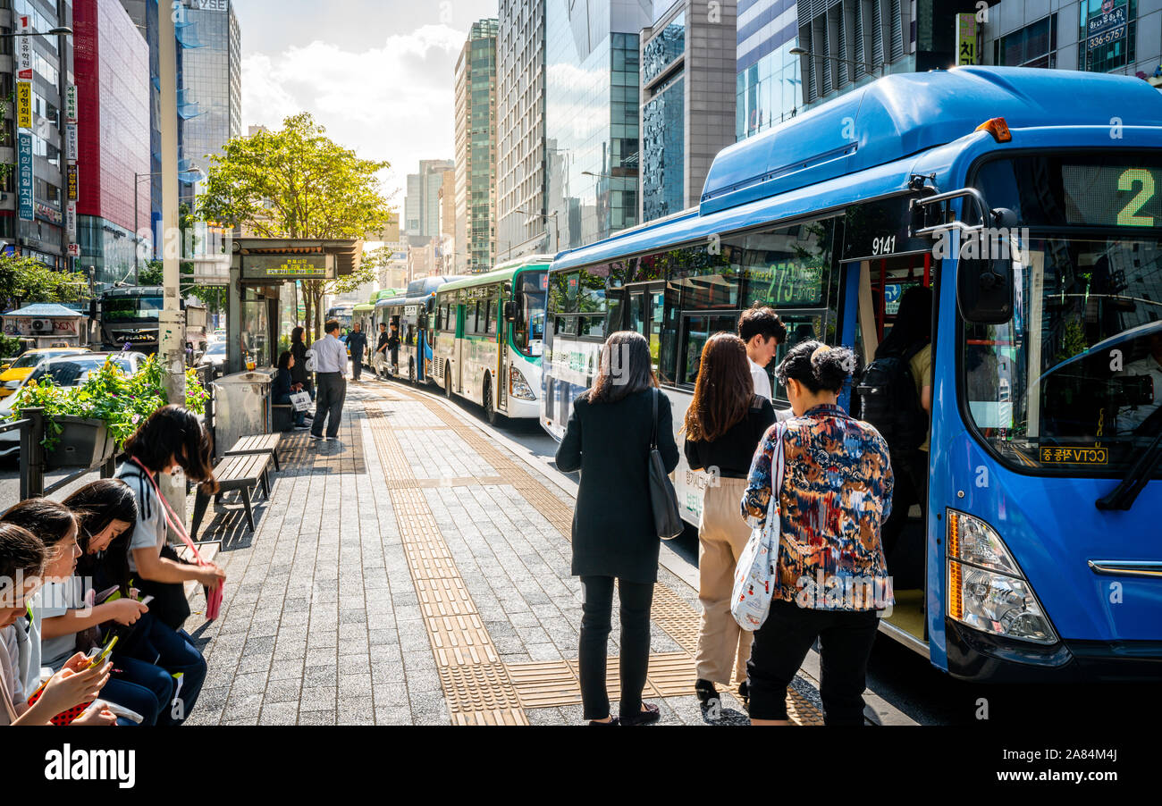 Seoul Korea , 23 September 2019 : People getting on a public transportation bus at a stop in Seoul South Korea Stock Photo