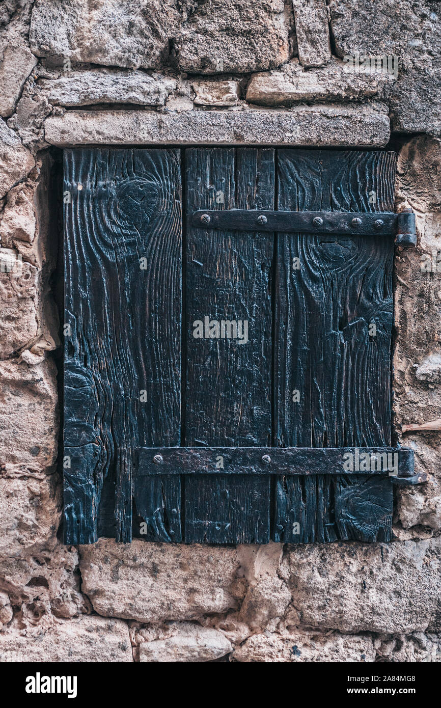 Ancient wooden window in a stone wall Stock Photo - Alamy