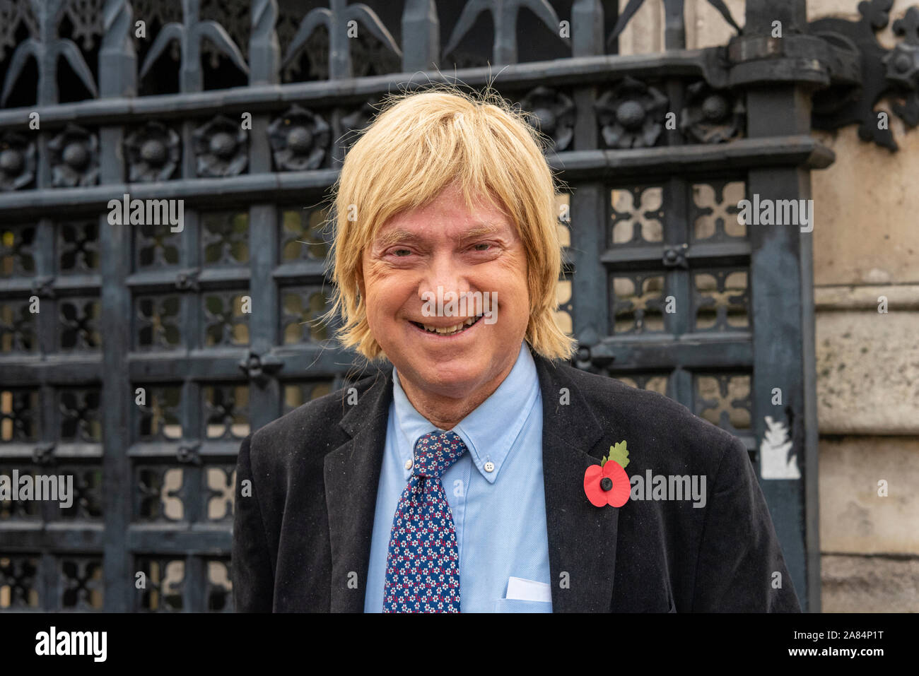 Michael Fabricant MP arriving at House of Commons for their last day of debates before Parliament is dissolved in preparation for the general election Stock Photo