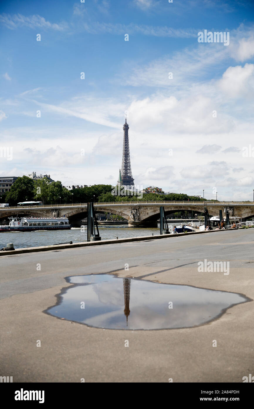 Eiffel tower reflection in a puddle, France Stock Photo