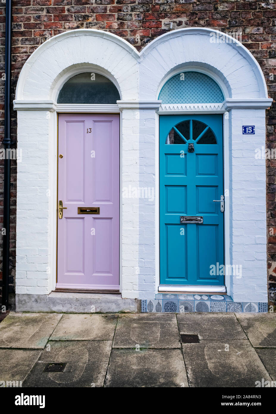 Merging, complementary but contrasting entrances to two Victorian properties, City of York, Yorkshire, UK Stock Photo