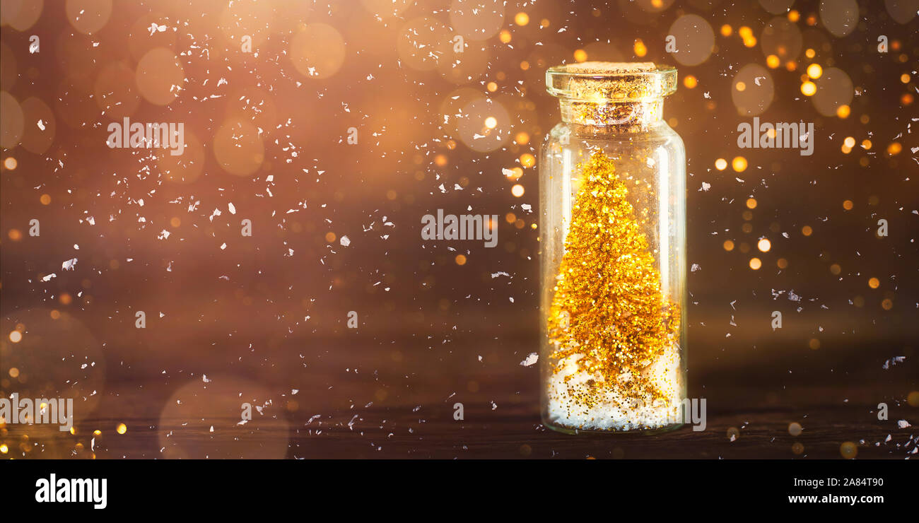 Miniature Gold Christmas Trees in Glass Baubles, which are in the form