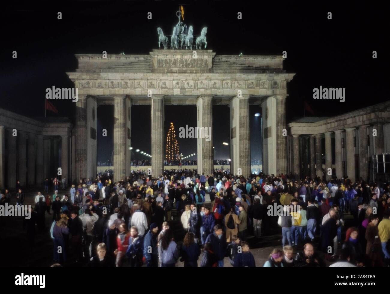 Fall of the Berlin Wall. In the photo celebrations for the new year at the  Brandenburg Gate December 31, 1989 - January 1, 1990, Berlin, Germany ---  Reunited Germans celebrate New Year's, image size:1300x980