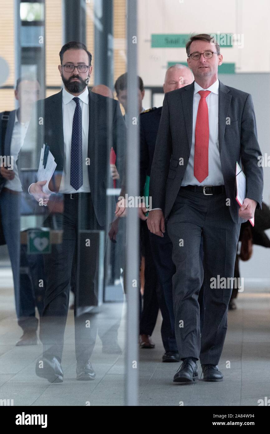 Dresden, Germany. 06th Nov, 2019. Sebastian Gemkow (CDU, l-r), Minister of Justice of Saxony, and Roland Wöller (CDU), Minister of the Interior of Saxony, come to a press conference behind a glass door in the Saxon state parliament. After several attacks by alleged left-wing extremists, Saxony wants to increase the pressure of persecution on the scene. Credit: Sebastian Kahnert/dpa-Zentralbild/dpa/Alamy Live News Stock Photo