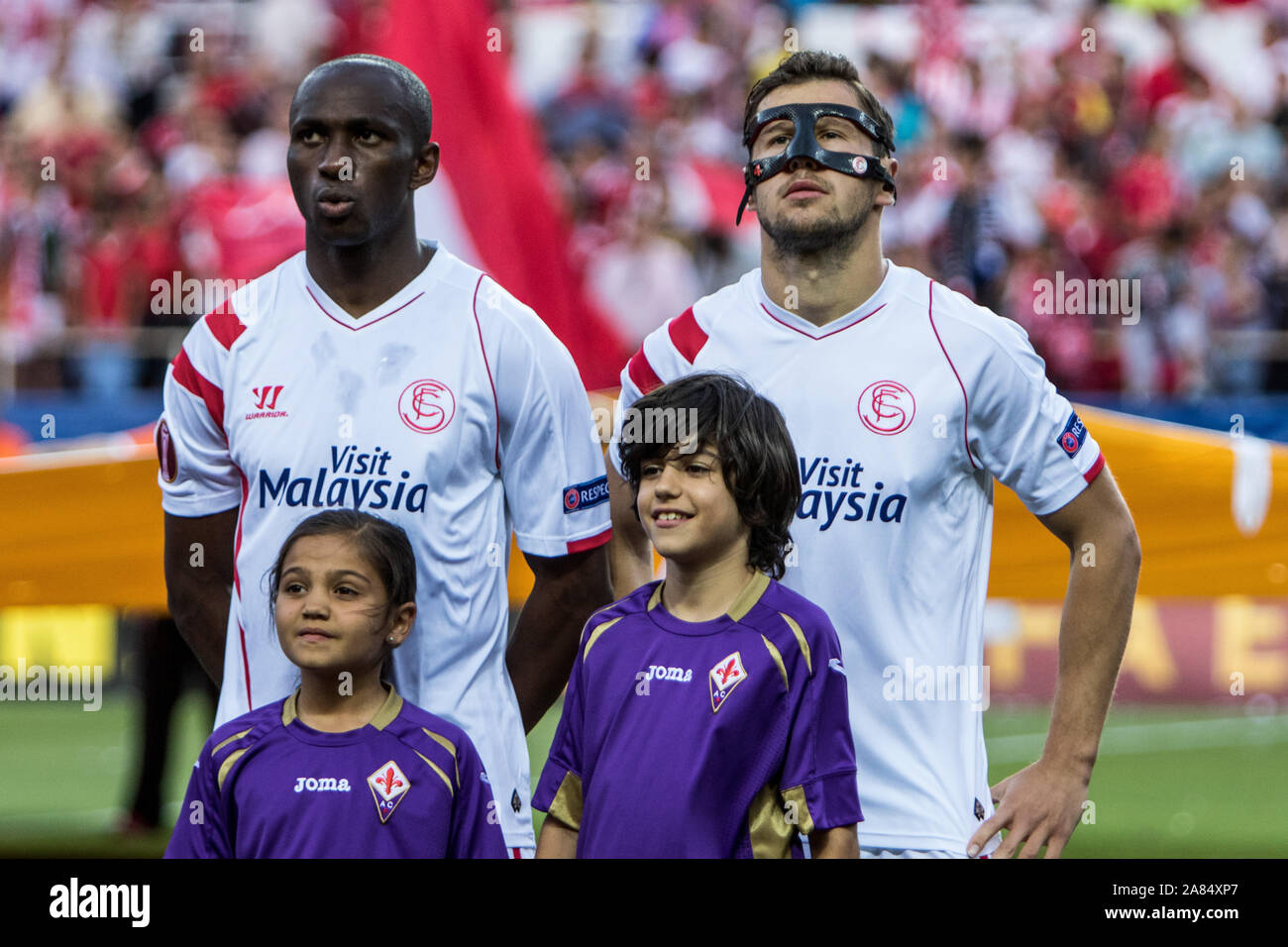 Mbia (L ) and Krychowiak (R ) of Sevilla FC before the match of Europa League (Semifinal, 1º leg) between Sevilla FC and Fiorentina at the Ramon Sanchez Pizjuan Stadium on 7 May, 2015 in Seville, Spain Stock Photo