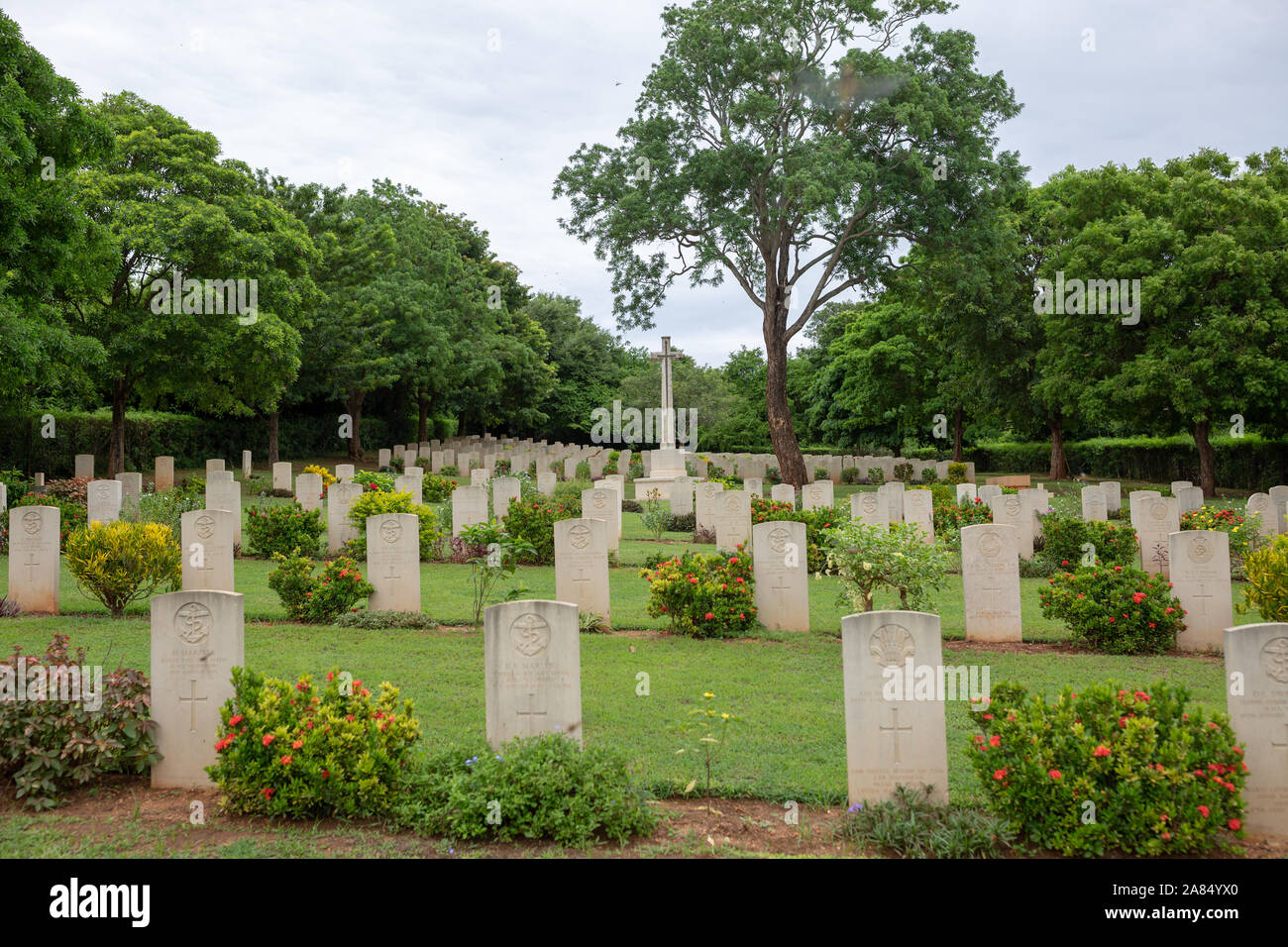 Sri Lanka, Trincomalee, Uppuveli, Commonwealth War Cemetery, graves and main cross memorial Stock Photo