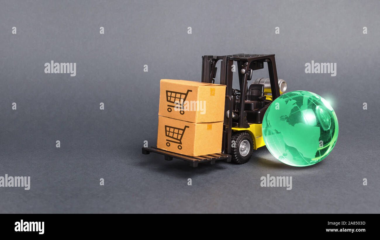 Forklift with boxes and a bright green glass globe. The concept of
