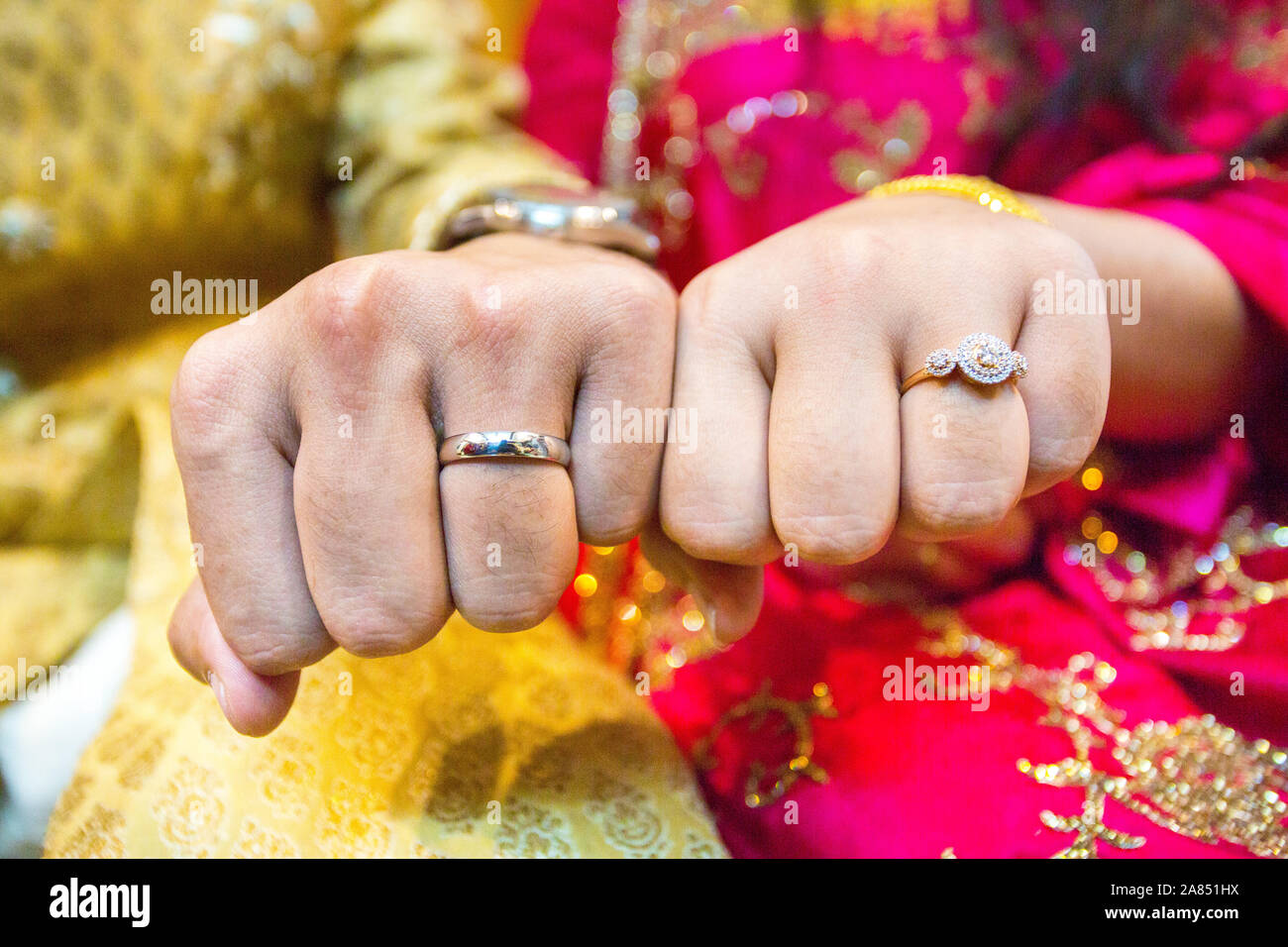 Married couple showing their wedding rings at Bangladesh. Close up