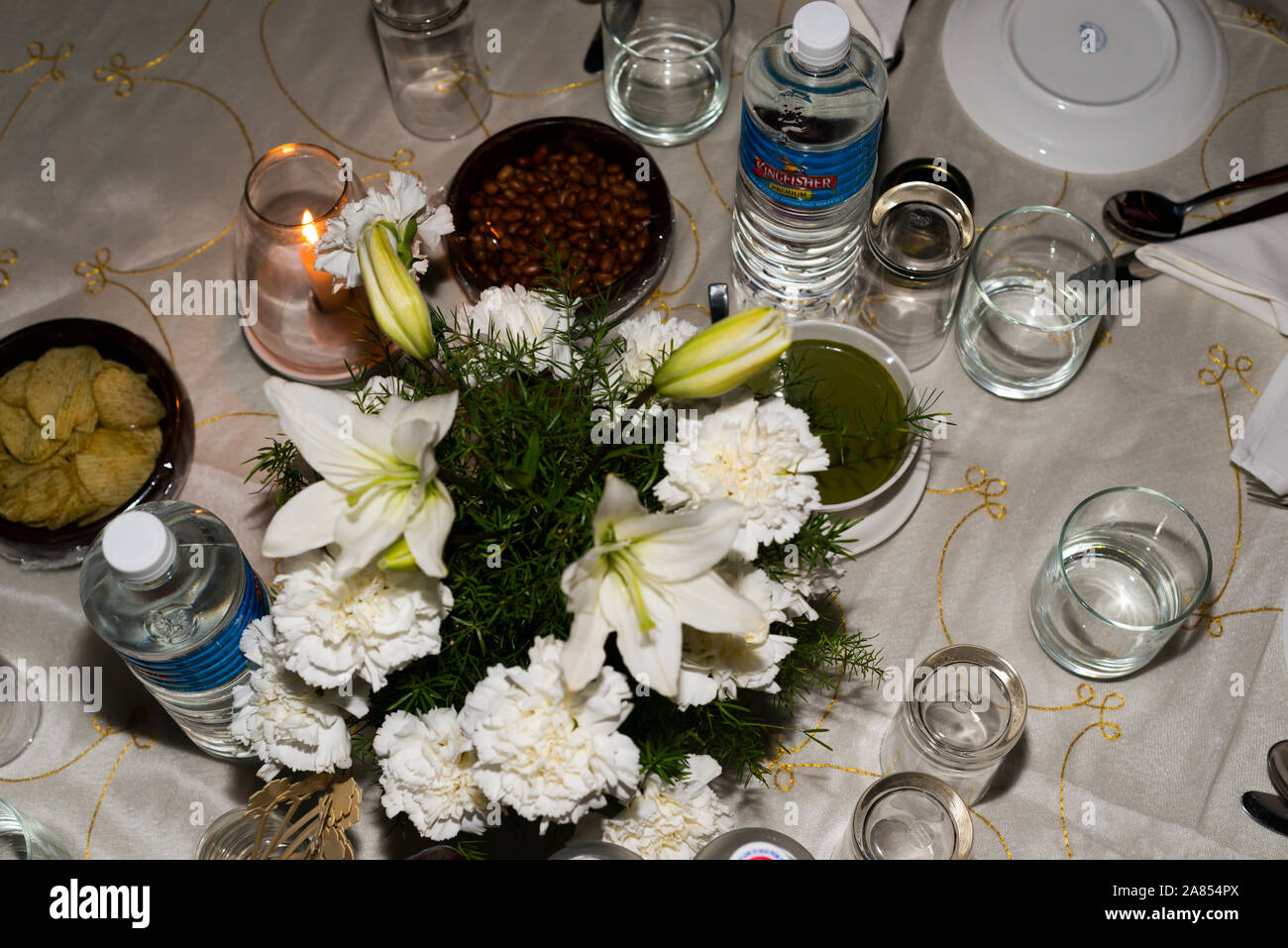 Night shot of candle light dinner table set at luxury resort on sea