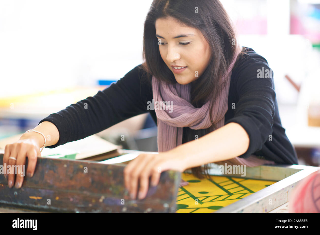 Female artist screen printing in art studio Stock Photo