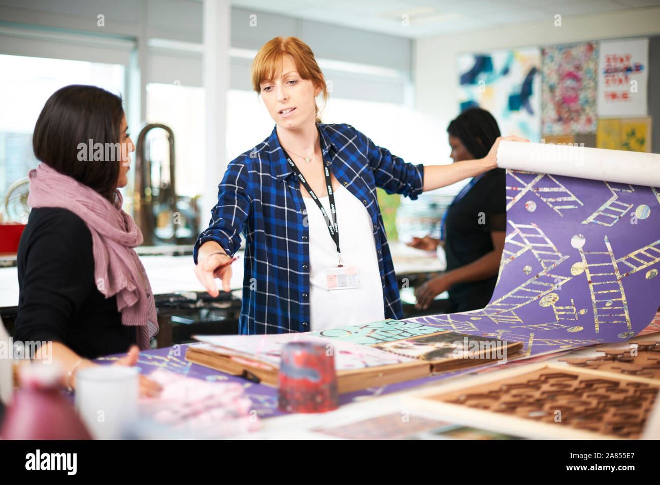 Women screen printing in art studio Stock Photo Alamy