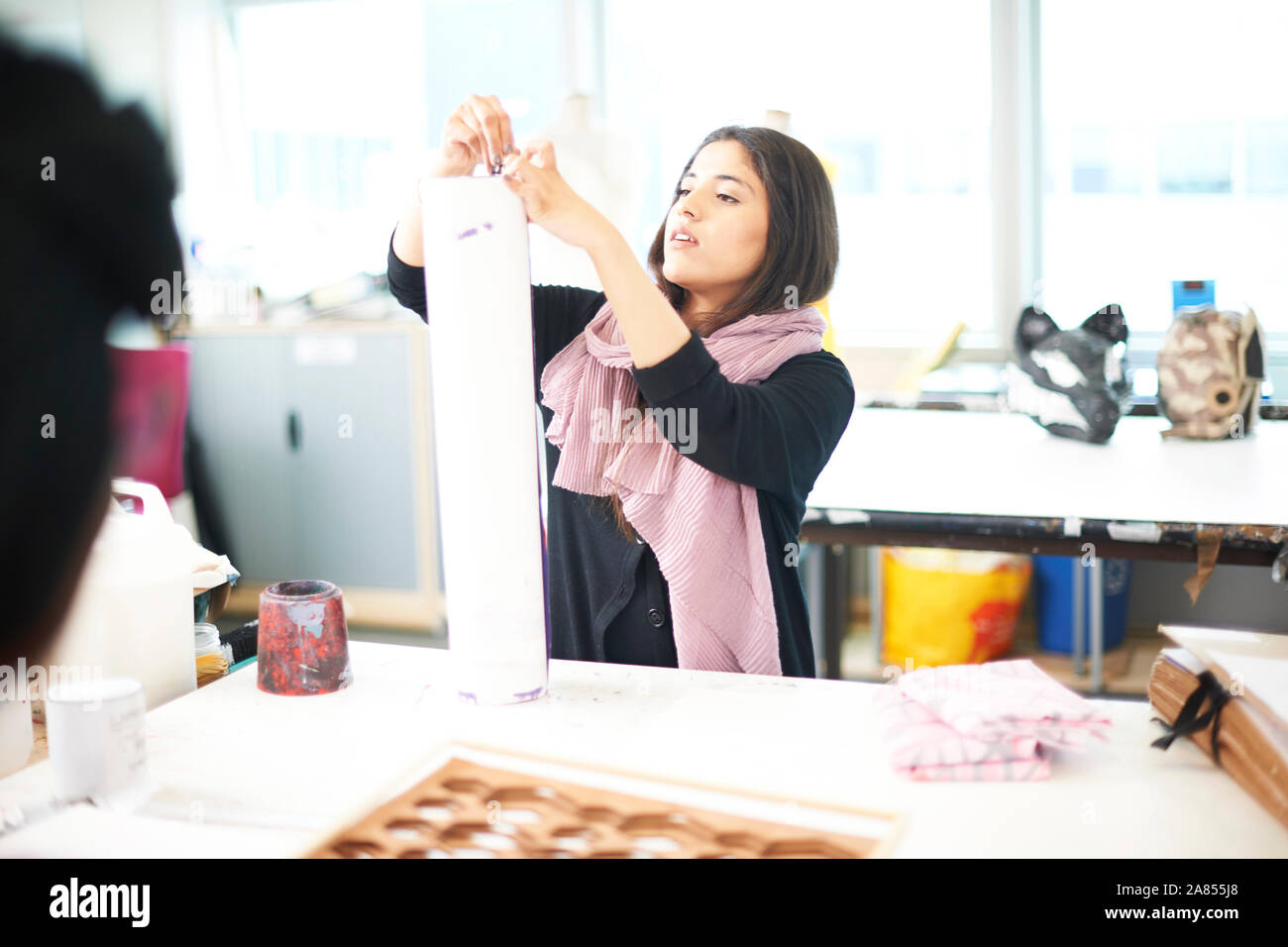 Female art student working in art studio Stock Photo