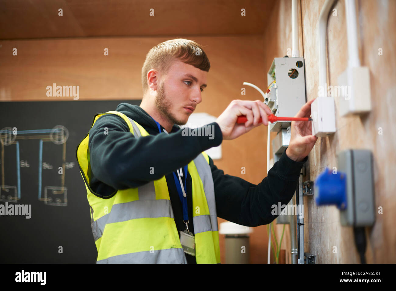 Male electrician student practicing in workshop Stock Photo