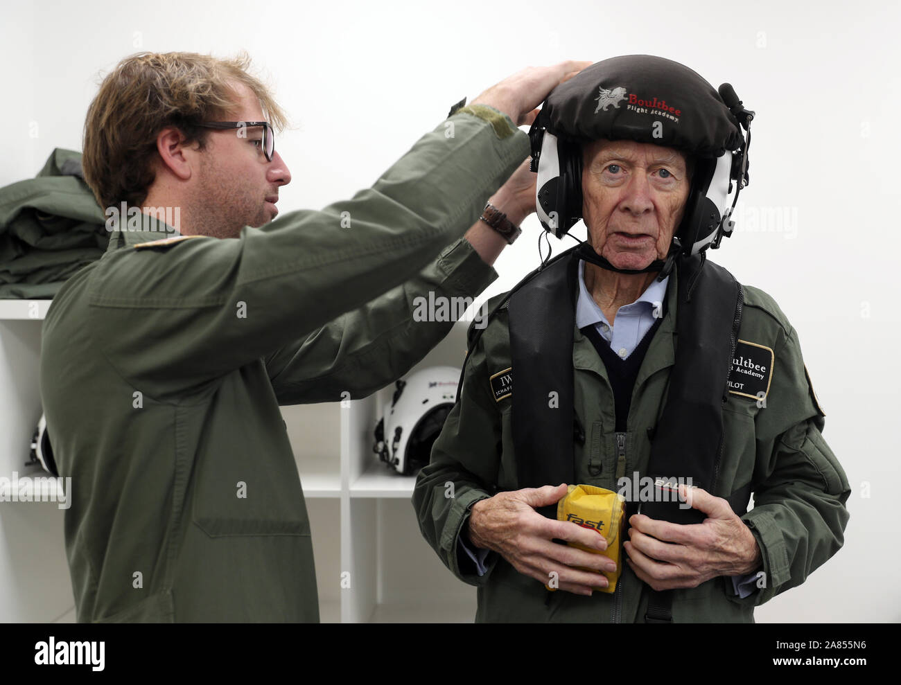 RAF veteran John Allinson is fitted with a helmet prior to a flight in a Spitfire at Solent Airport, who has achieved the 'ambition of a lifetime' by taking a flight in a Spitfire organised as a thank you for his 'selfless' caring for his wife. PA Photo. Picture date: Wednesday November 6, 2019. John Allinson, from Reading, Berkshire, was given the chance to fly in the fighter plane after his granddaughter contacted the Red Letter Days experience gift company. The 85-year-old, who served in the military police for five years from the age of 17 and who reached the rank of corporal, took his fli Stock Photo