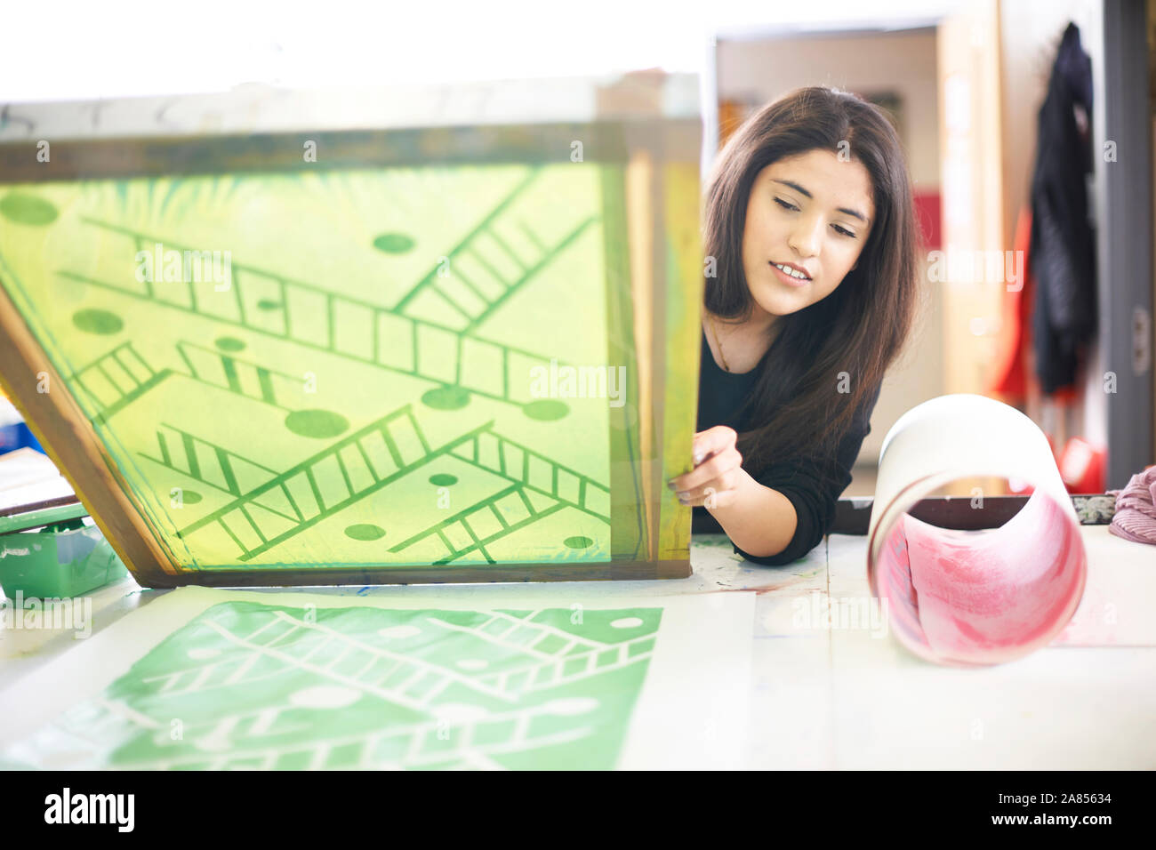 Female artist screen printing in art studio Stock Photo