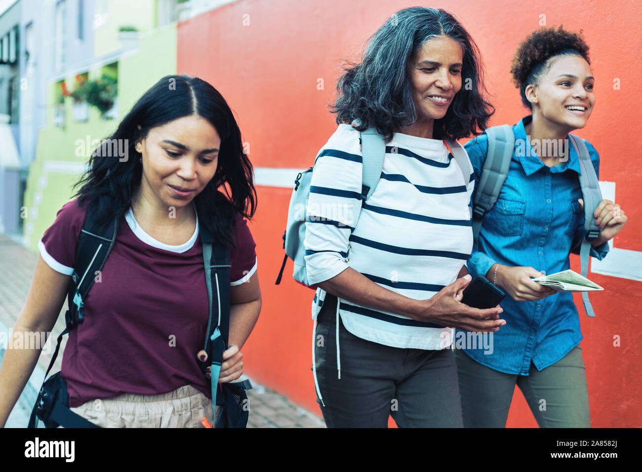 Mother and daughter tourists walking Stock Photo