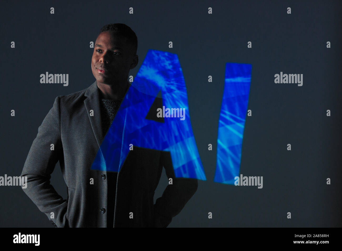Double exposure businessman against AI text Stock Photo