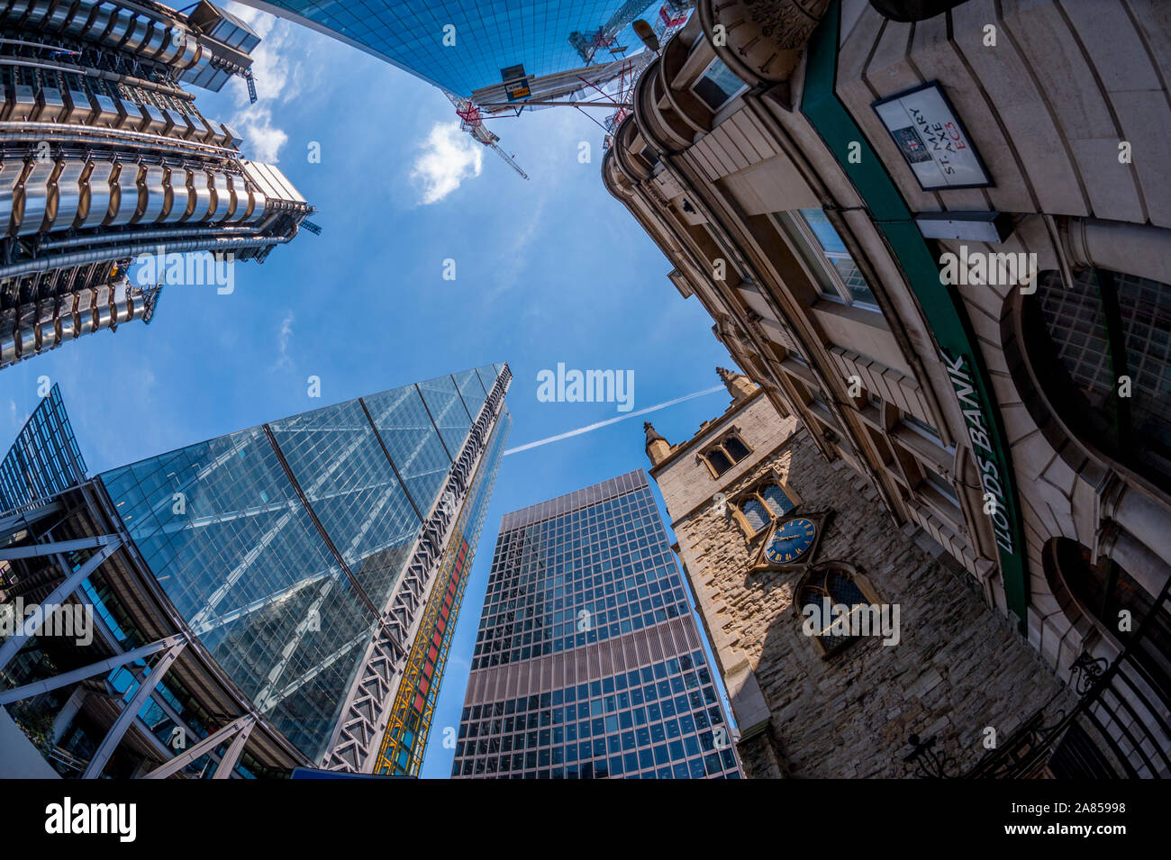 Looking up at 122 Leadenhall Street, also known as the Leadenhall Building or the Cheesegrater with the Lloyds building at Left Stock Photo