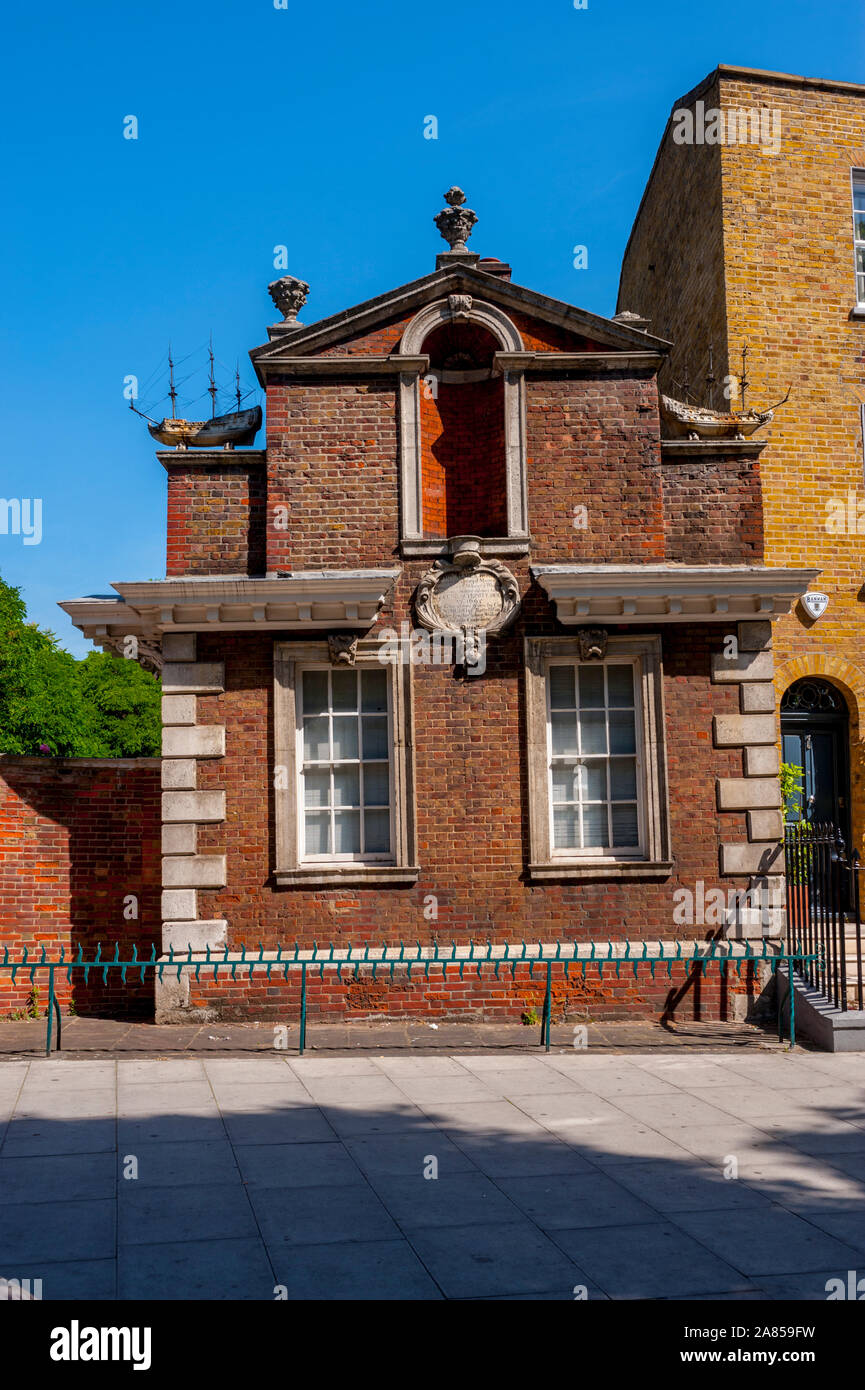 Gate house of the trinity Alms houses on the Mile End Road London Stock