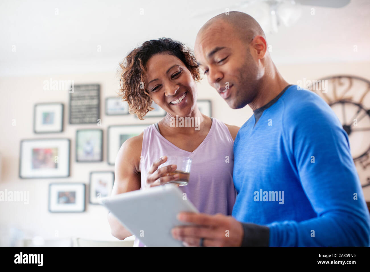 Happy couple using digital tablet Stock Photo