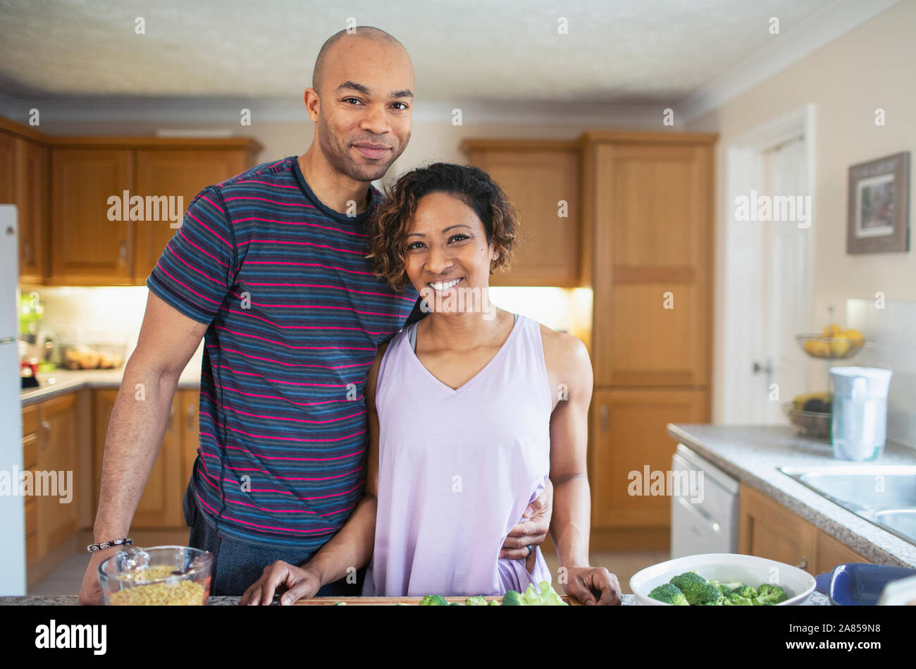 Smiling Man Holding Grater Vegetables Girlfriend Spatula Stove