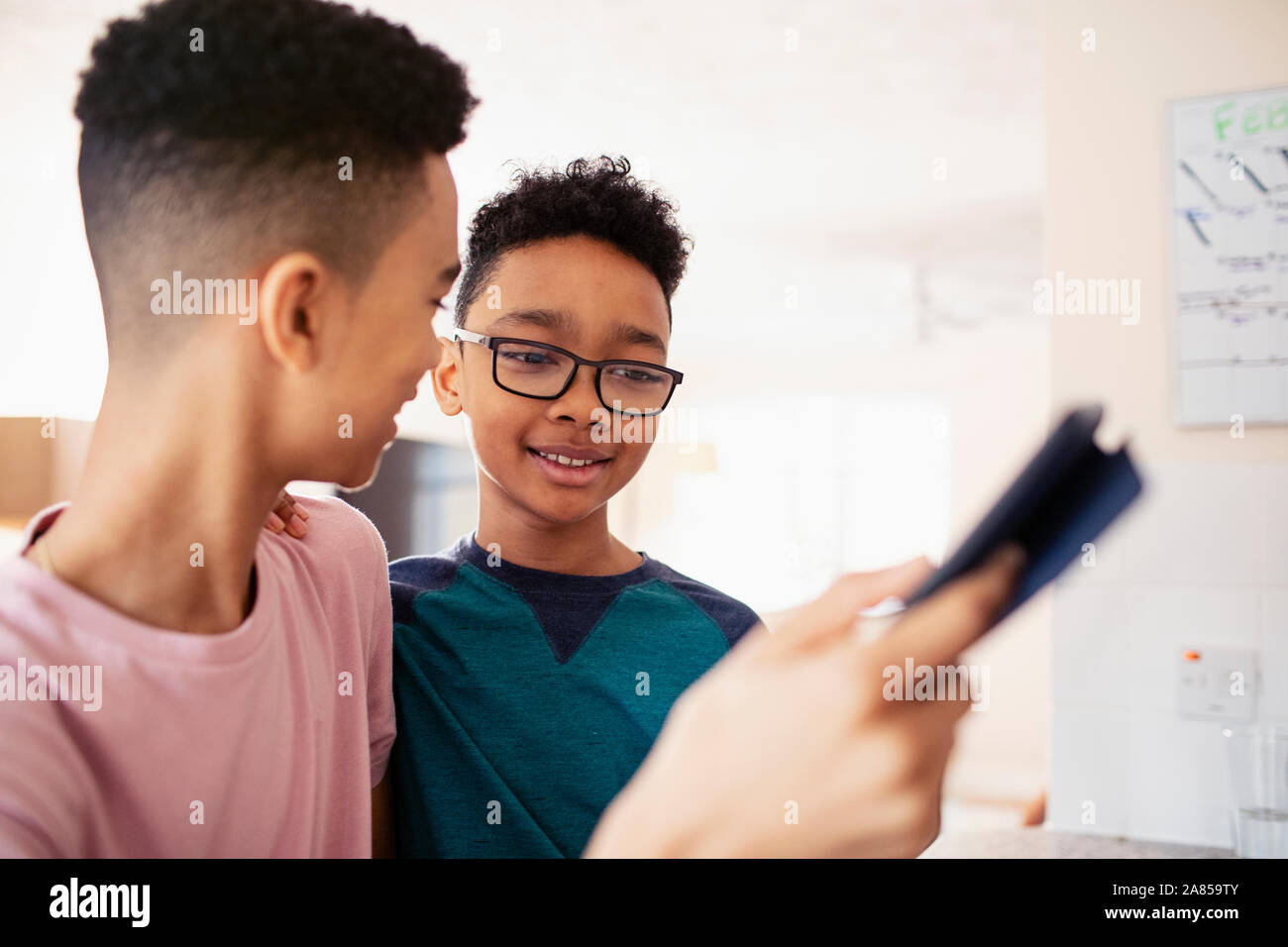 Brothers using digital tablet Stock Photo