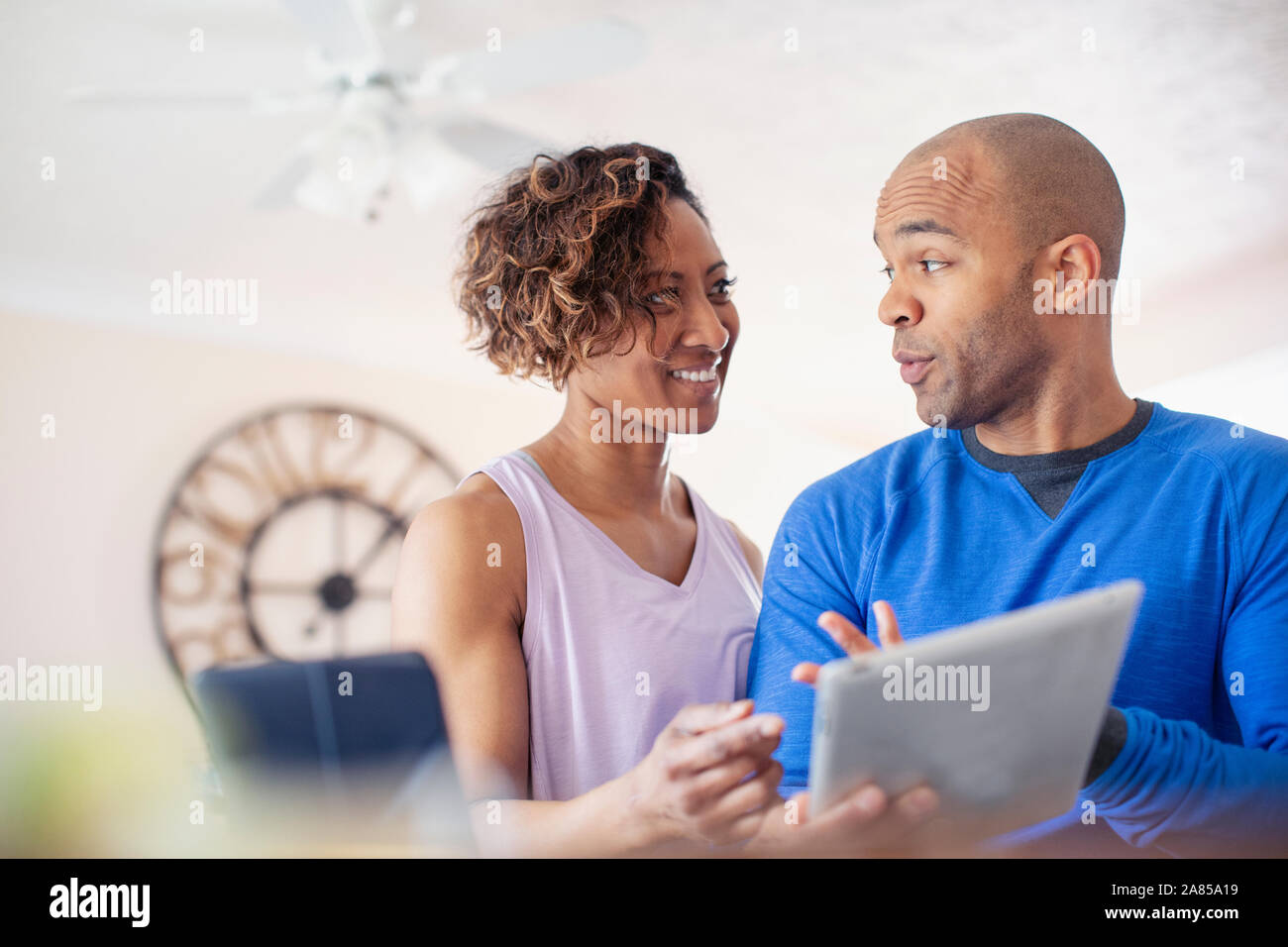 Couple talking, using digital tablet Stock Photo
