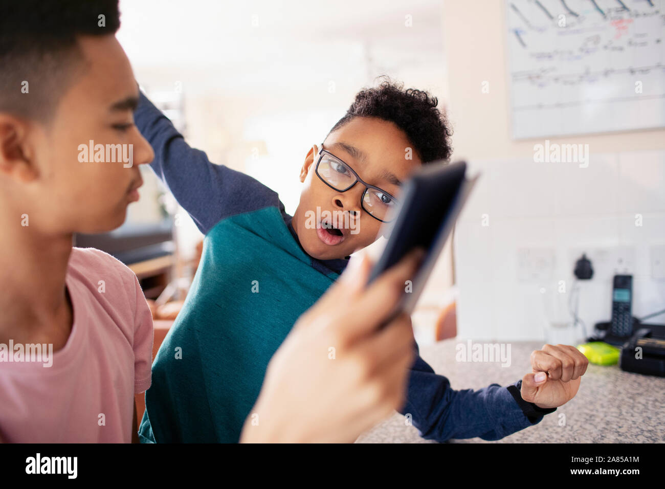 Brothers using digital tablet Stock Photo