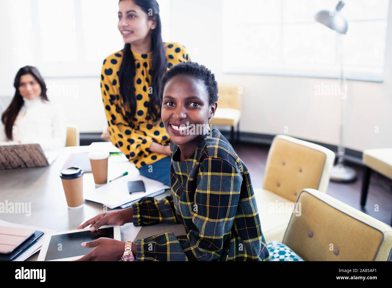 Portrait smiling, confident businesswoman in conference room meeting Stock Photo