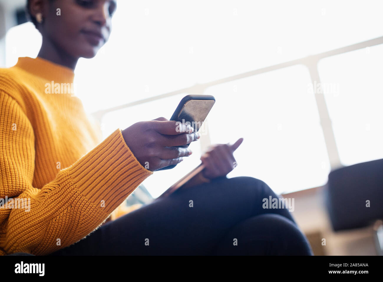 Businesswoman using smart phone Stock Photo
