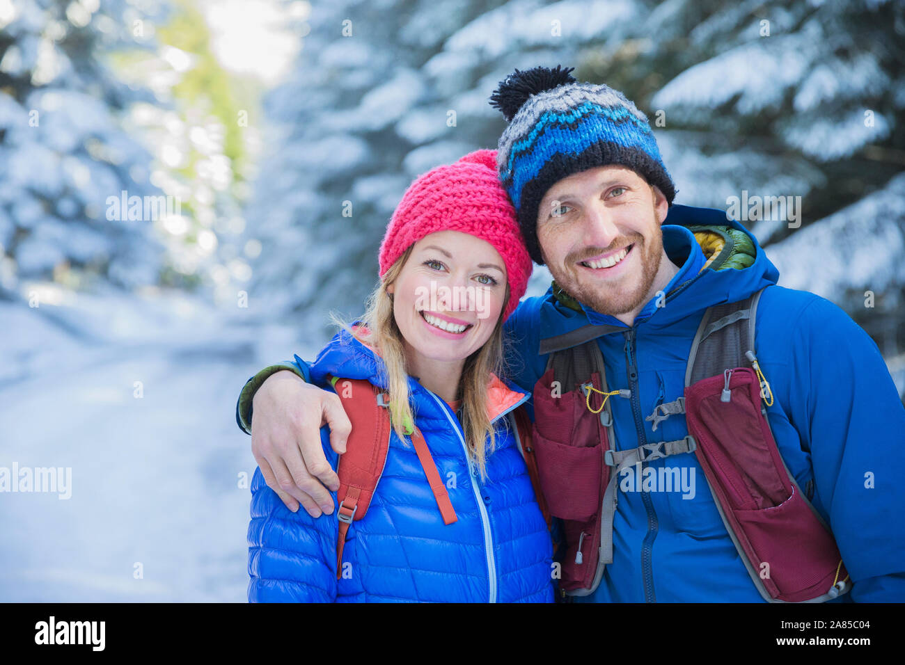 Happy couple in the snowy forest hi-res stock photography and images ...