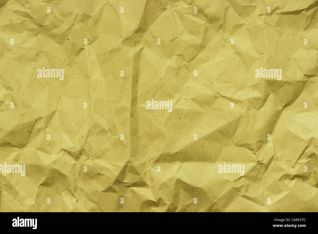 Kraft paper for packaging products and goods. Rough crumpled brown