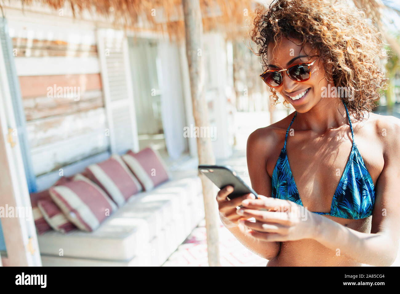 Cell phone in bikini hi-res stock photography and images - Alamy